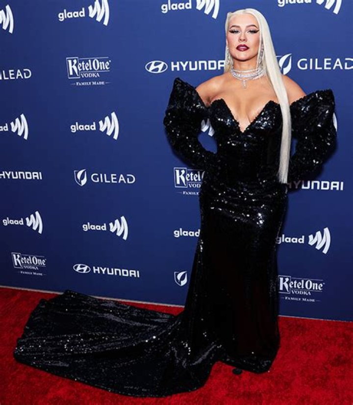 Christina Aguilera Wears Strapless Gown, Leather Gloves & Hair In Pigtails For ‘Elle Mexico’ Cover