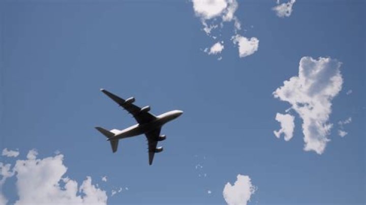 Jay Leno, 71, Hangs Out Of A Moving Plane During Insane Mid-Air Stunt — Watch
