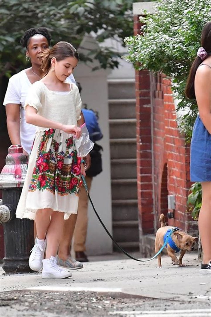Suri Cruise Walks Her Adorable Dog & Is Ready To Poop & Scoop Her Pet — See Sweet Pic